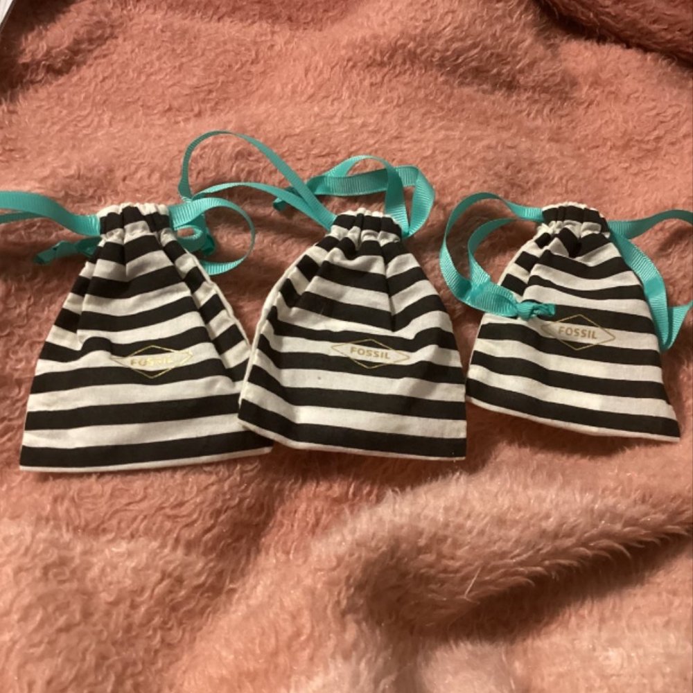 Three (3) Fossil dust bags